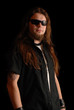 Heavy metal singer on black background