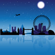London skyline silhouette at night with reflection on thames