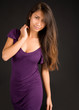 Beautiful Brunette Lady Posing in a Purple Dress