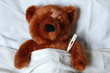 sick teddy with injury in bed sick teddy with injury in bed