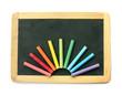 Blackboard and chalks in rainbow