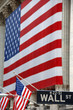 Wall Street, street sign, with US flag Wall Street, street sign, with US flag