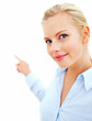 Young business woman pointing towards copyspace