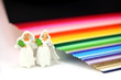 Photo: Lesbian couple standing by rainbow. Gay marriage concept. Lesbian couple standing by rainbow. Gay marriage concept.