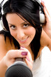 top view of female with headphone and microphone with white back
