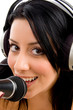 close up of woman with headphone and microphone on an isolated w