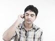 a handsome asian male of indian origin listening to music