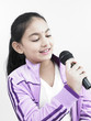 asian girl of indian origin singing into her mike