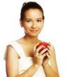 Pretty young smiling woman with red apple