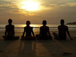 Yoga at sunset by the ocean Yoga at sunset by the ocean
