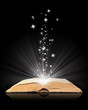 Open book magic on black Open book magic on black