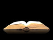 Open book magic on black Open book magic on black