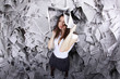 Business woman surrounded by newspapers everywhere Business woman surrounded by newspapers everywhere