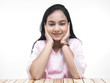 portrait of an asian teenage girl covering her ears