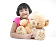 portrait of an asian girl with her brown teddy bear