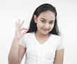 portrait of an asian teenage girl giving a good signal