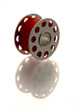 metallic spool of red thread