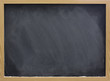 blank blackboard with white chalk dust and smudges