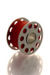metallic spool of red thread