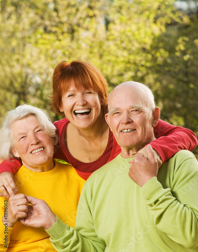 Senior couple with their daughter outdoors