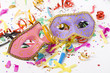 Photo: carnival masks and colorful confetti on white carnival masks and colorful confetti on white