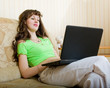 young beautiful woman with a black laptop