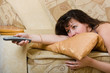 Brunette woman watching TV set