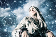 Young blond woman in a blizzard