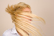 Blonde girl flipping hair