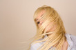 Blonde girl flipping hair