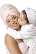 Happy caring mother and daughter at bathtime