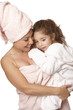 Doting nurturing mother and daughter at bathtime