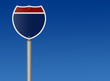 Interstate sign against blue sky