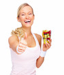Success - Healthy young woman showing thumbs up