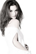 brunette in white shirt on white background high key looking at brunette in white shirt on white background high key looking at