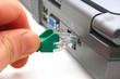 Hand Plugging Ethernet Cable into Port Hand Plugging Ethernet Cable into Port