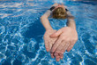Woman swimming in swimming pool