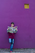 Teen reads with purple wall Teen reads with purple wall