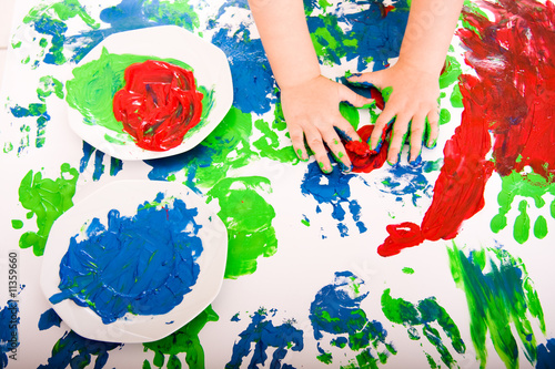 Small child hand painting