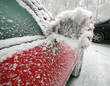 Red car with outside mirror covered of icing Red car with outside mirror covered of icing