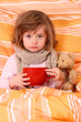 Little girl  sitting sick in bed