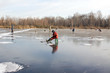 Fishermen on ice of the frozen lake