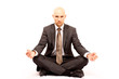 Photo: meditating Businessman, isolated against white background meditating Businessman, isolated against white background