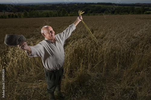 Photo: Farmer standing in field Farmer standing in field