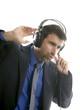Businessman hearing, singing music, headphones