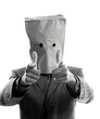 Businessman with paper bag in head