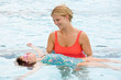 Photo: Mother Helping Daughter To Float on Her Back Mother Helping Daughter To Float on Her Back