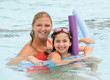Photo: Mother and Daughter Playing in the Pool Mother and Daughter Playing in the Pool