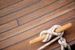 Sailing knot on a wooden floor Sailing knot on a wooden floor