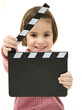 little girl holding a clapperboard isolated on white background